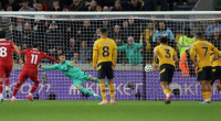 Liverpool reclaim top spot as Salah penalty beats Wolves